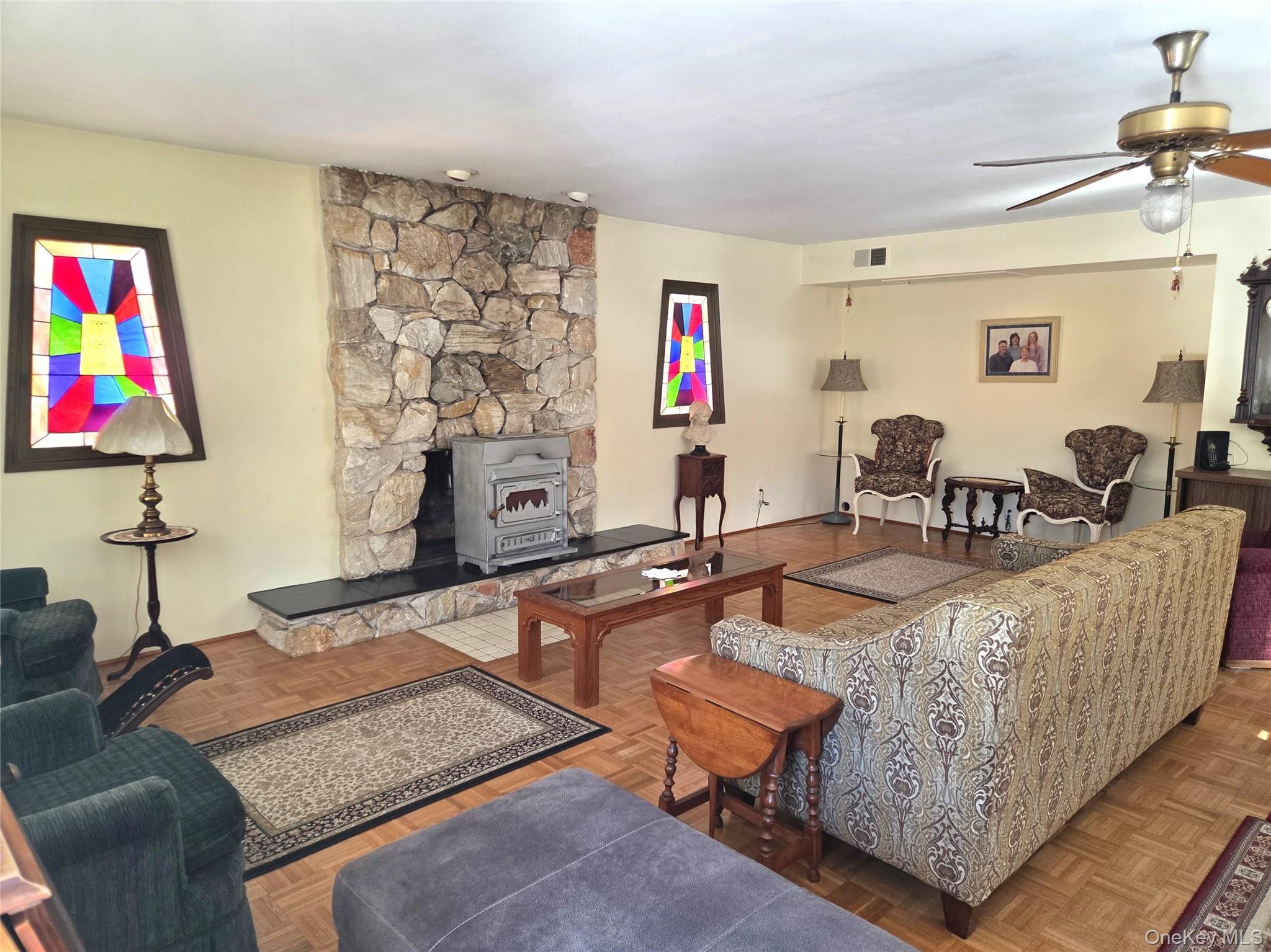 22 Hill Road St. James, NY 11780 - Photo 4 of 13 a living room with furniture and a flat screen tv