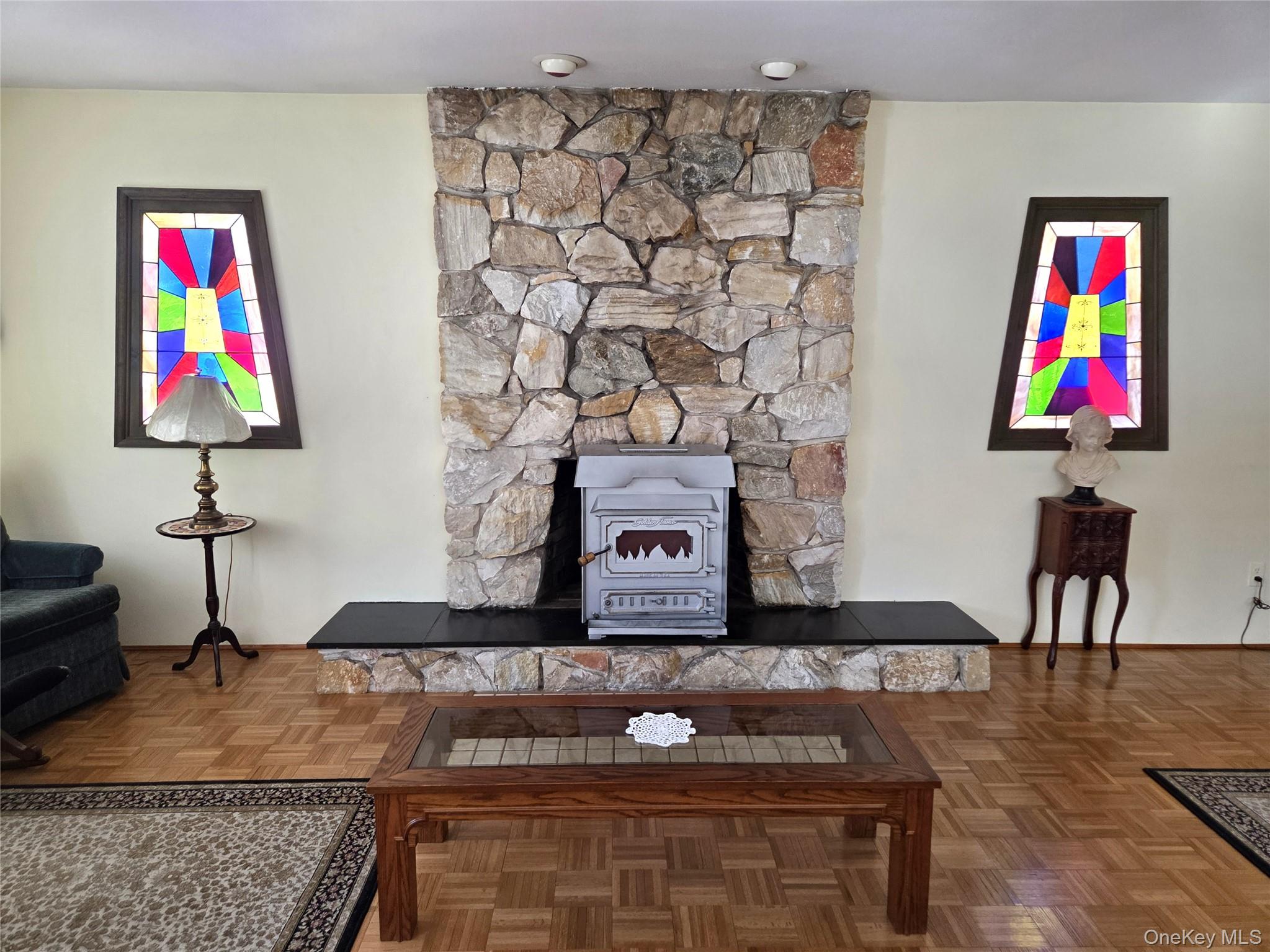 22 Hill Road St. James, NY 11780 - Photo 5 of 13 a living room with furniture and painting on the wall