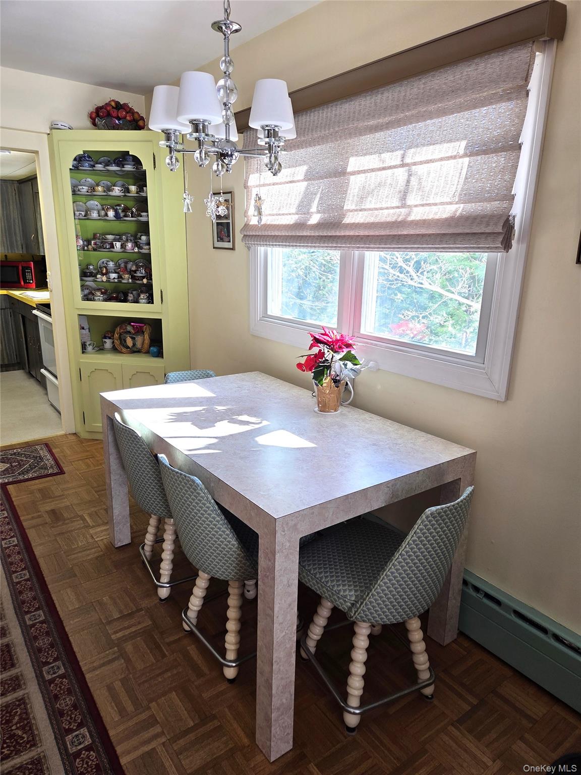 22 Hill Road St. James, NY 11780 - Photo 7 of 13 a view of a dining room with furniture window and wooden floor