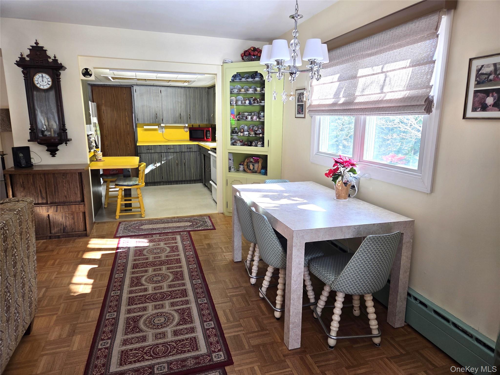 22 Hill Road St. James, NY 11780 - Photo 8 of 13 a view of a dining room with furniture window and wooden floor