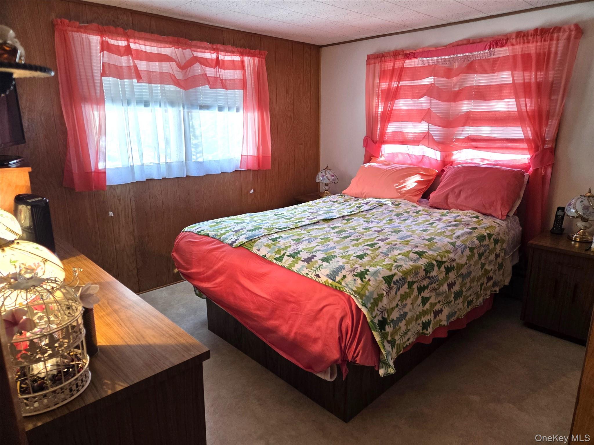 22 Hill Road St. James, NY 11780 - Photo 10 of 13 a bedroom with a bed and window