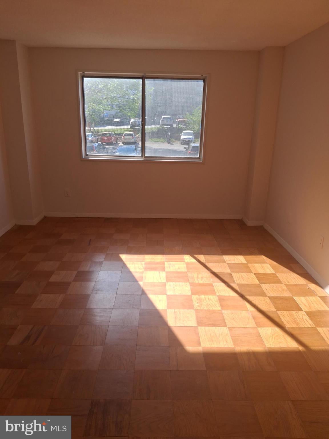 1836 Metzerott Road, Unit 222 Hyattsville, MD 20783 - Photo 2 of 9 a view of an empty room and window