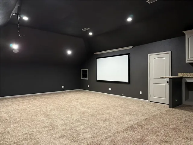 a view of an empty room with a fireplace