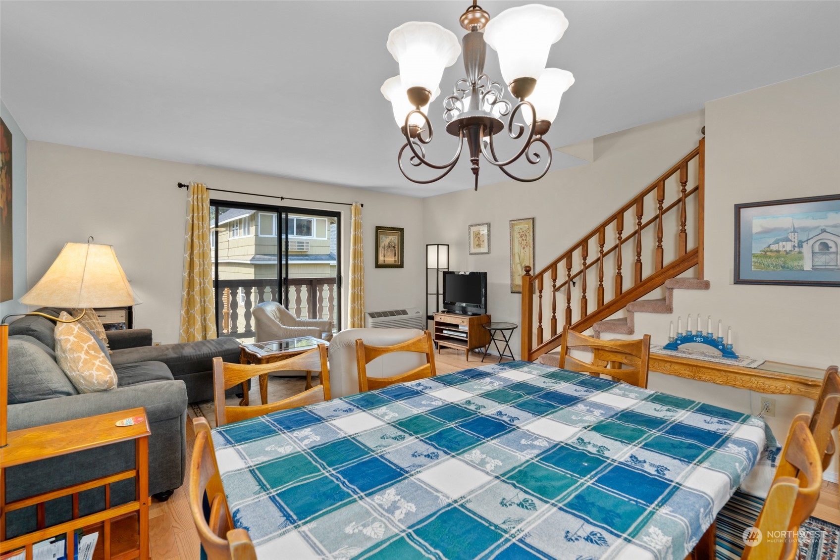 325 Division Street, Unit C Leavenworth, WA 98826 - Photo 15 of 25 a bedroom with furniture and a chandelier