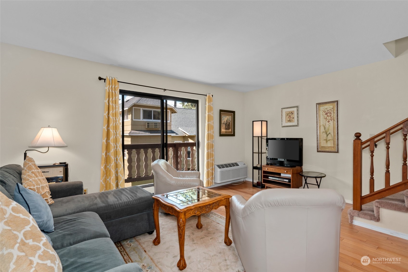325 Division Street, Unit C Leavenworth, WA 98826 - Photo 5 of 25 a living room with furniture a flat screen tv and a fireplace