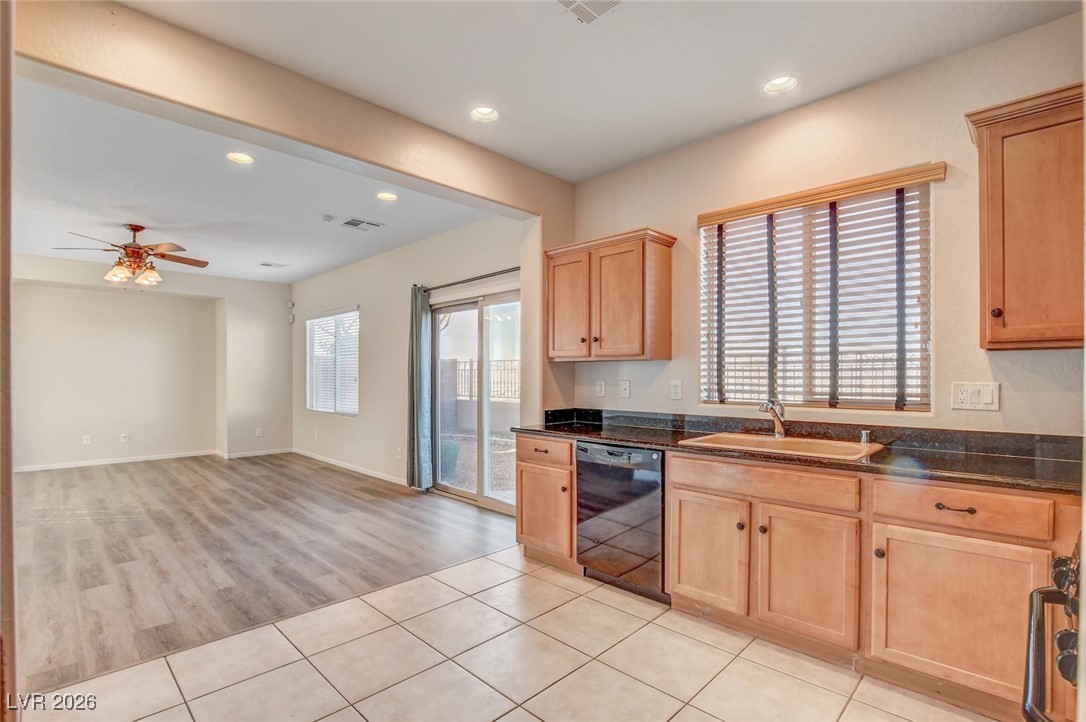 2460 Rue Bienville Way Henderson, NV 89044 - Photo 16 of 50 Kitchen featuring dishwasher, recessed lighting, light brown cabinets, healthy amount of natural light, and a ceiling fan
