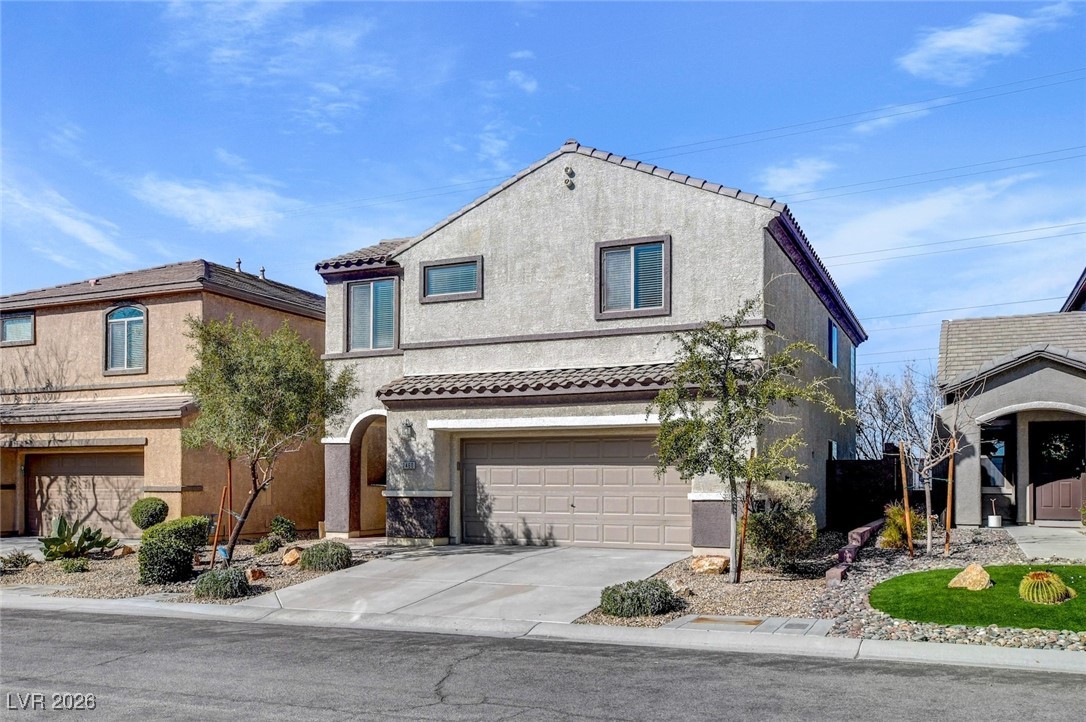 2460 Rue Bienville Way Henderson, NV 89044 - Photo 2 of 50 Mediterranean / spanish home featuring a garage, concrete driveway, stucco siding, and a tiled roof