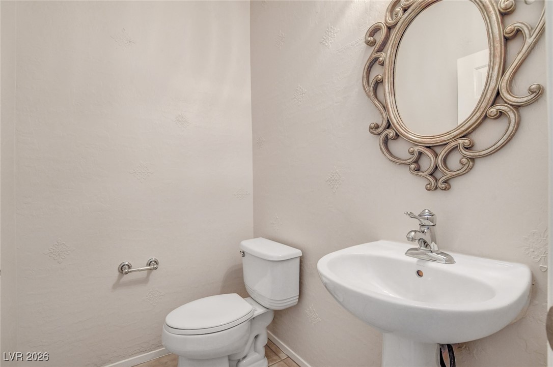 2460 Rue Bienville Way Henderson, NV 89044 - Photo 22 of 50 Bathroom featuring toilet and a sink