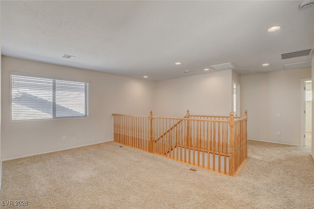 2460 Rue Bienville Way Henderson, NV 89044 - Photo 26 of 50 Spare room with light carpet and recessed lighting