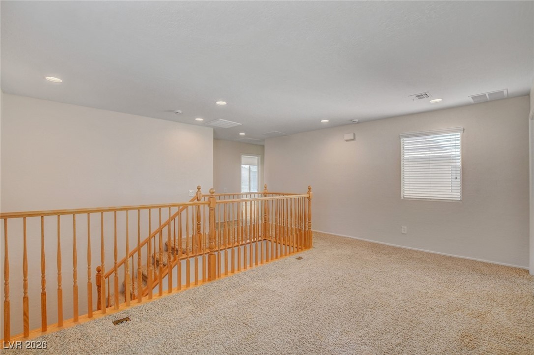 2460 Rue Bienville Way Henderson, NV 89044 - Photo 27 of 50 Carpeted spare room with recessed lighting and baseboards