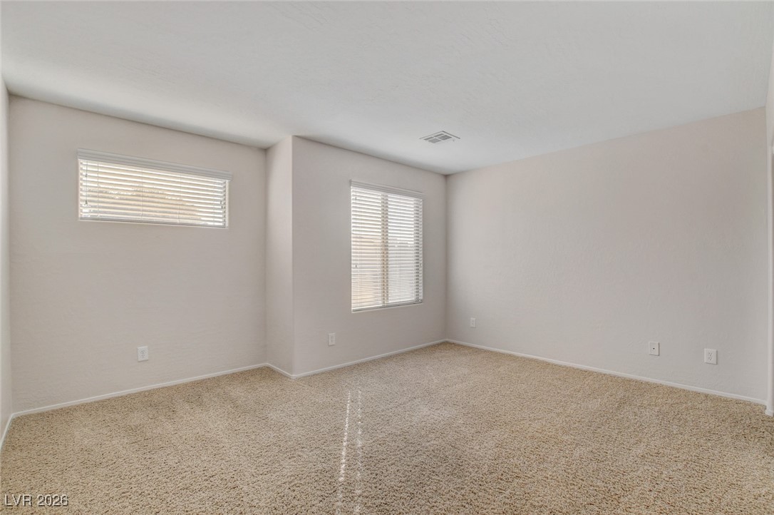 2460 Rue Bienville Way Henderson, NV 89044 - Photo 39 of 50 Unfurnished room with baseboards and carpet flooring