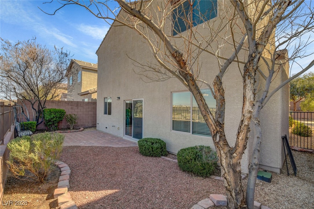 2460 Rue Bienville Way Henderson, NV 89044 - Photo 48 of 50 Rear view of house featuring a patio, a fenced backyard, and stucco siding