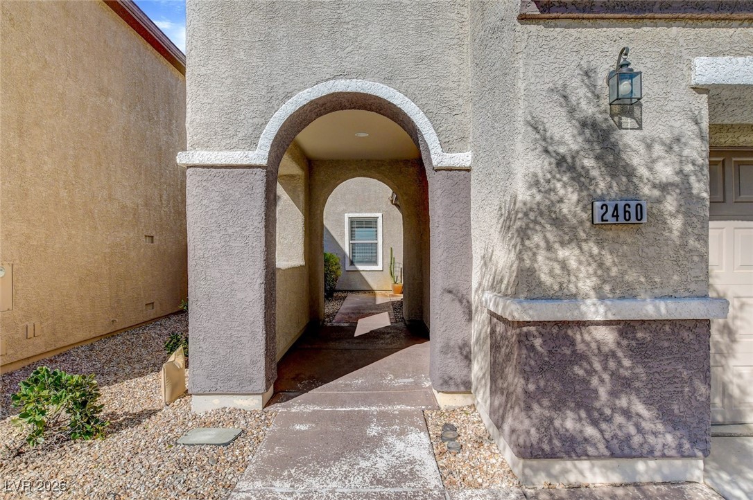 2460 Rue Bienville Way Henderson, NV 89044 - Photo 5 of 50 Doorway to property with stucco siding