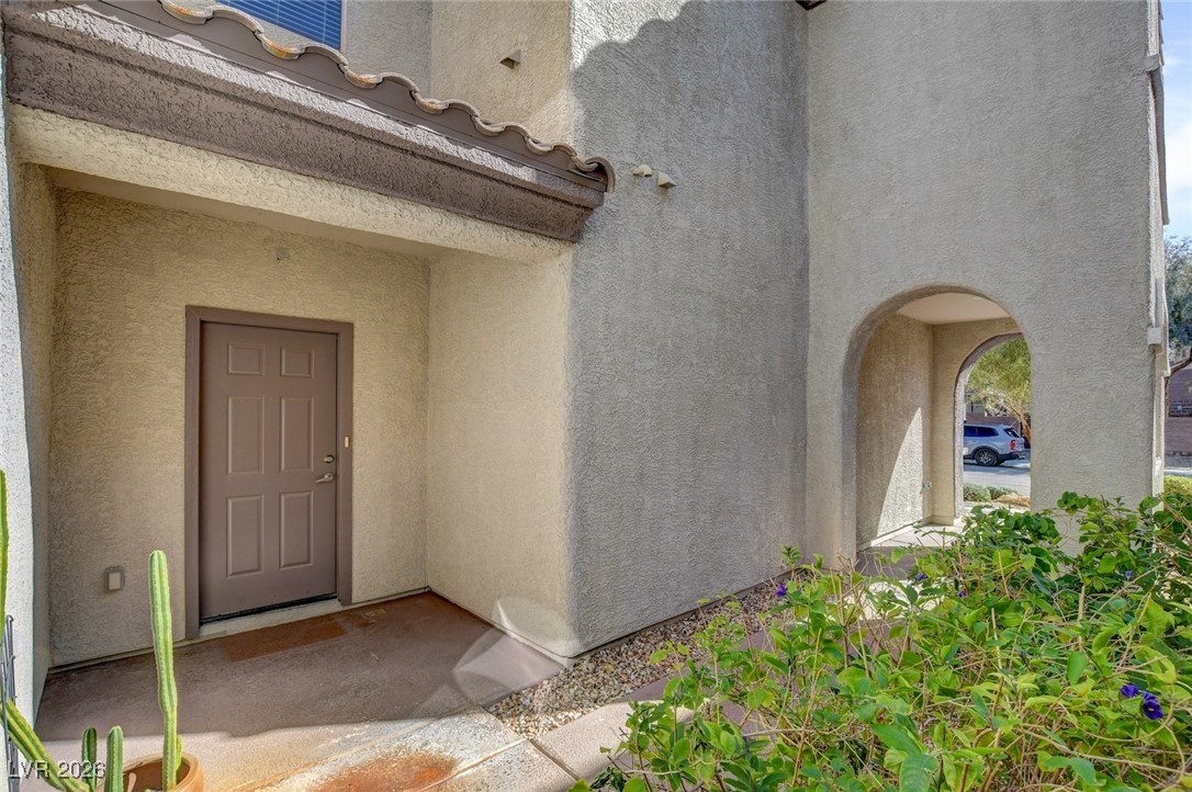 2460 Rue Bienville Way Henderson, NV 89044 - Photo 7 of 50 Property entrance featuring stucco siding