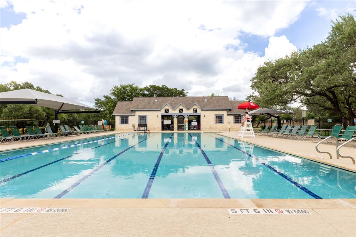 7136 Ridge Oak Road Austin, TX 78749 - Photo 24 of 28 A refreshing community pool with ample lounging space.