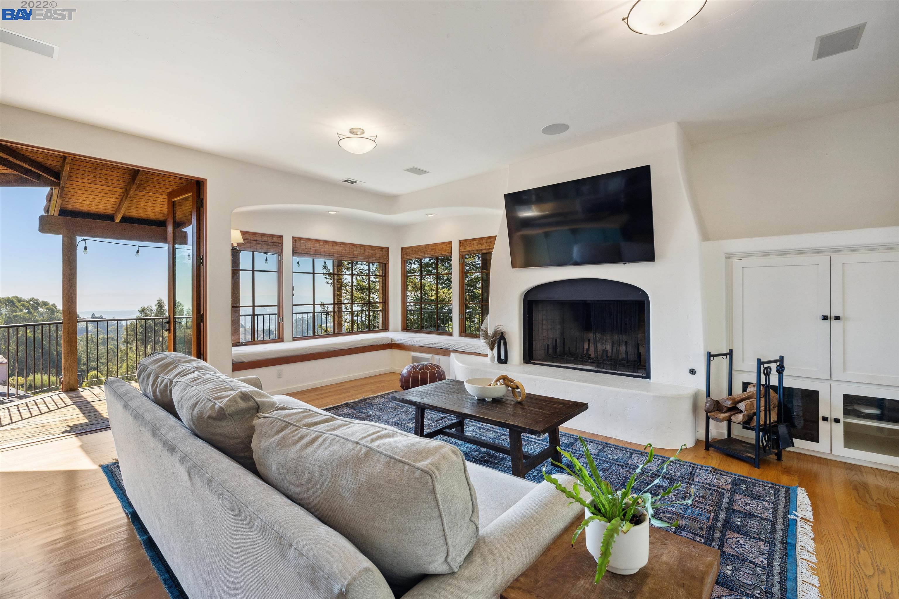 a living room with furniture fireplace and a flat screen tv