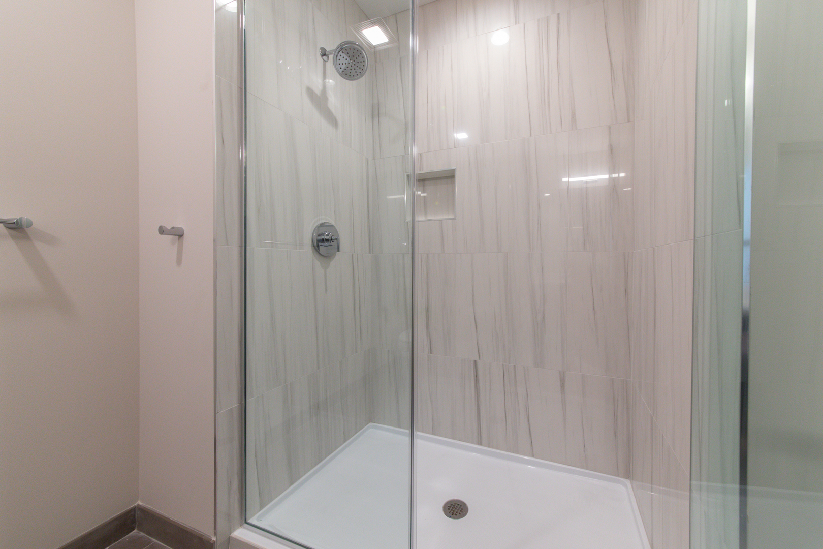 1116 Courtland Avenue, Unit 304 Park Ridge, IL 60068 - Photo 13 of 19 a bathroom with a glass shower door