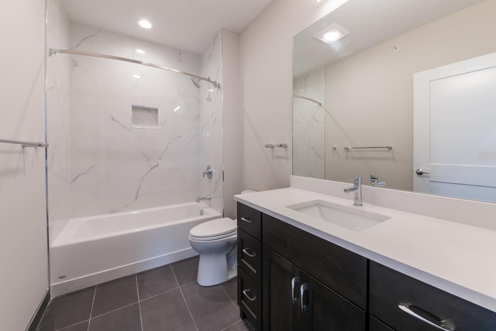 1116 Courtland Avenue, Unit 304 Park Ridge, IL 60068 - Photo 15 of 19 a bathroom with a sink a toilet and shower