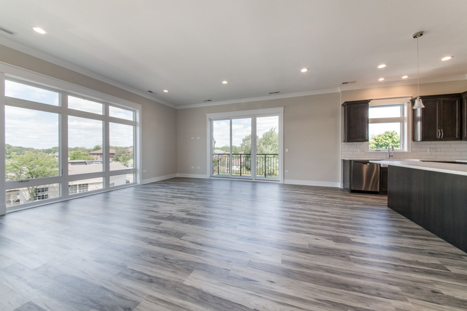1116 Courtland Avenue, Unit 304 Park Ridge, IL 60068 - Photo 2 of 19 an empty room with wooden floor and windows