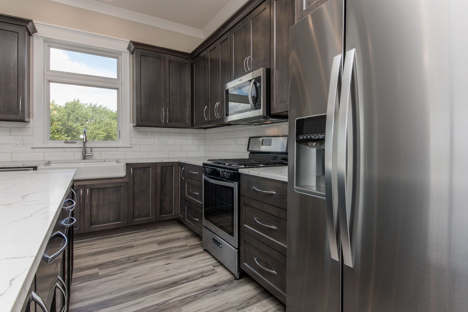 1116 Courtland Avenue, Unit 304 Park Ridge, IL 60068 - Photo 5 of 19 a kitchen with stainless steel appliances granite countertop a refrigerator and a sink