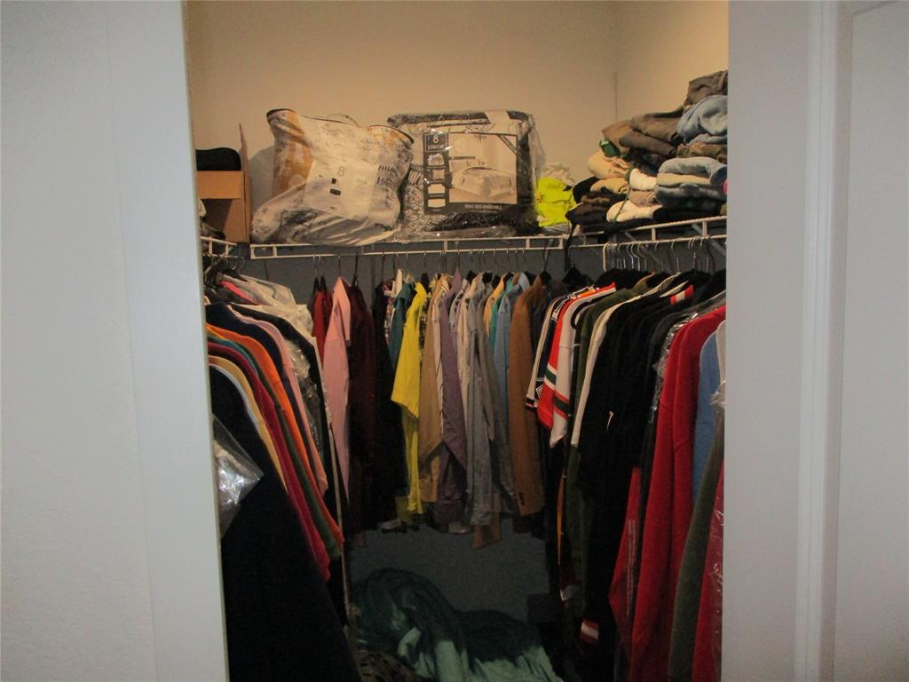 Undisclosed Address Homestead, FL 33030 - Photo 14 of 19 a view of walk in closet with clothes and shoes