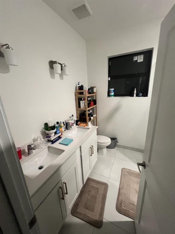 Undisclosed Address Homestead, FL 33030 - Photo 16 of 19 a bathroom with a sink toilet and mirror