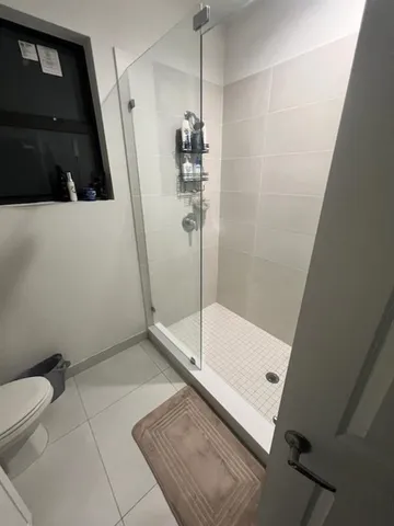 a bathroom with a sink and a shower