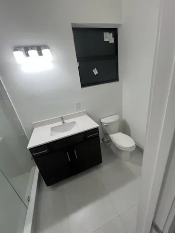 a bathroom with a sink and a toilet