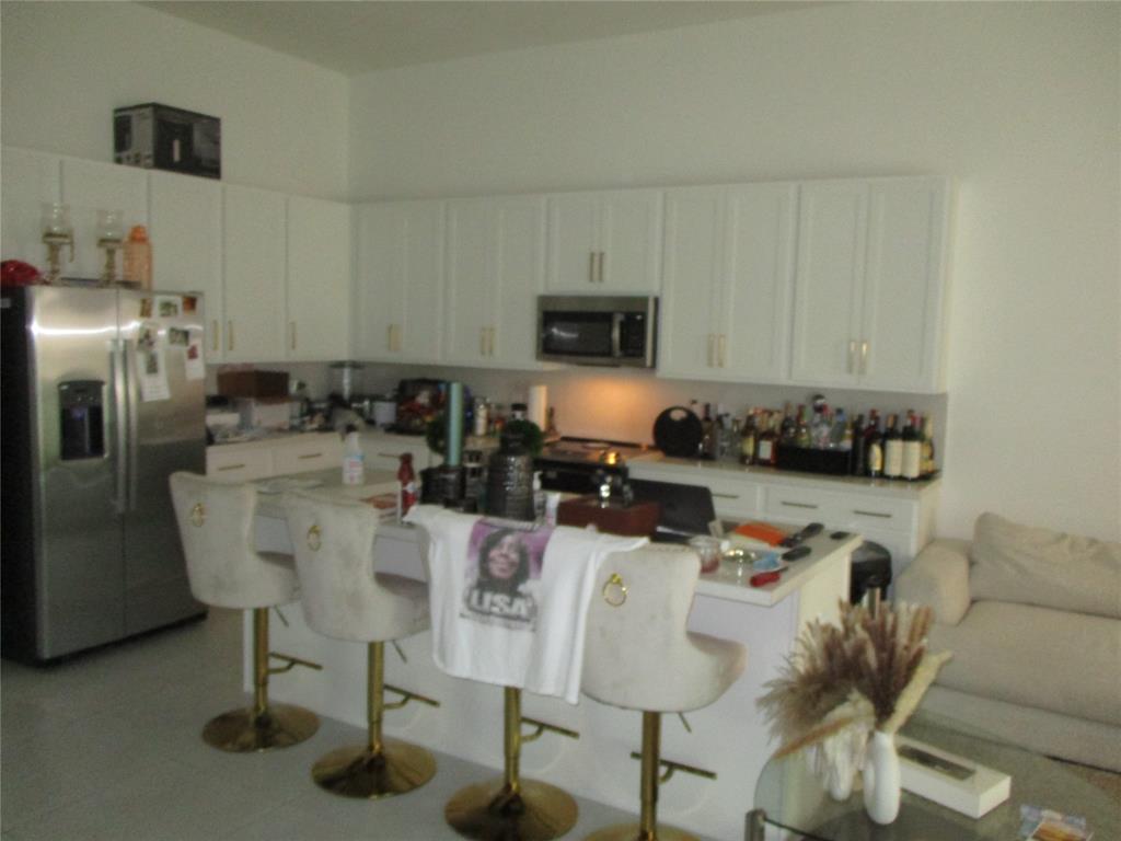Undisclosed Address Homestead, FL 33030 - Photo 9 of 19 a dining room with furniture and a window