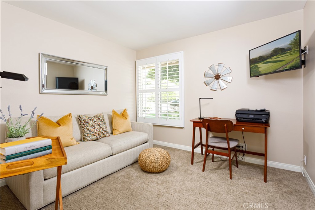 3103 Via Serena North, Unit A Laguna Woods, CA 92637 - Photo 11 of 17 a living room with furniture and a flat screen tv