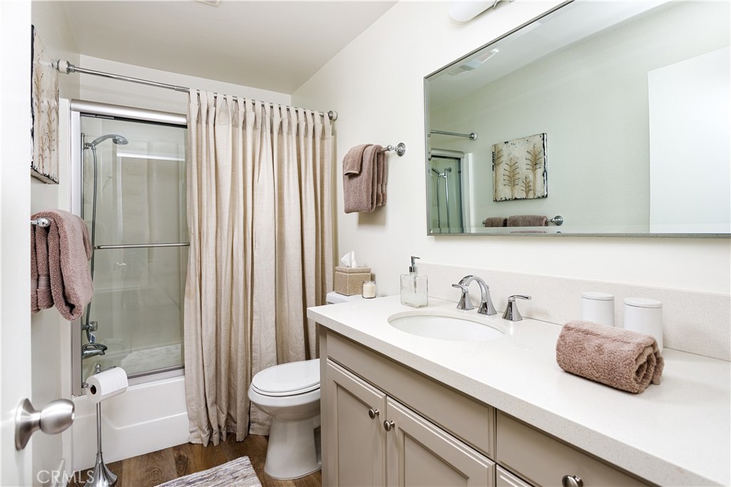 3103 Via Serena North, Unit A Laguna Woods, CA 92637 - Photo 12 of 17 a bathroom with a sink a toilet and shower