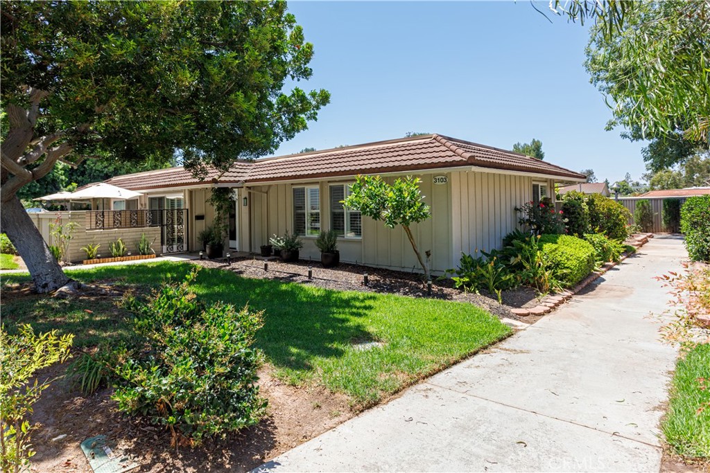 3103 Via Serena North, Unit A Laguna Woods, CA 92637 - Photo 16 of 17 a view of a house with a yard