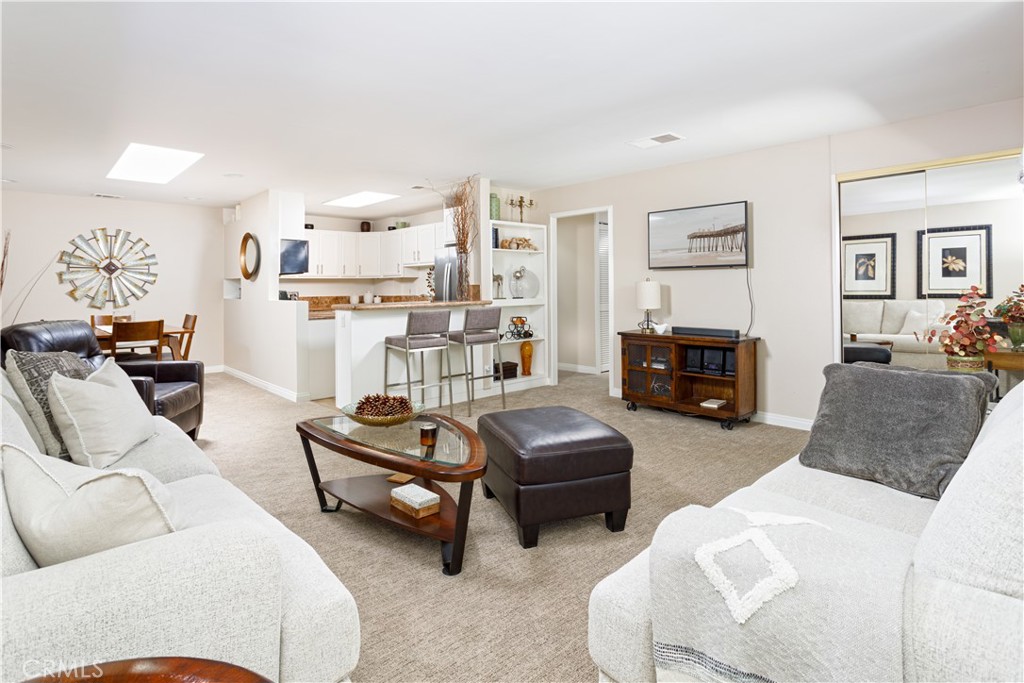 3103 Via Serena North, Unit A Laguna Woods, CA 92637 - Photo 5 of 17 a living room with furniture and a fireplace