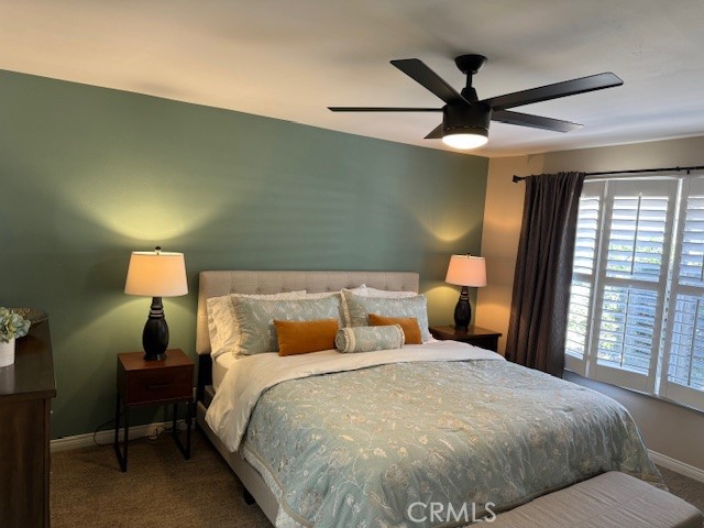 3103 Via Serena North, Unit A Laguna Woods, CA 92637 - Photo 9 of 17 a bed room with a bed and a lamp