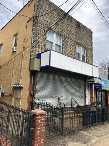 a front view of a house with parking