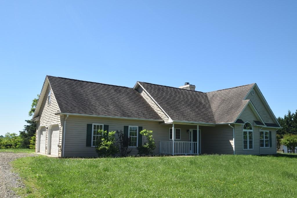 4027 Goodview Town Road Moneta, VA 24121 - Photo 1 of 21 a front view of house with yard and green space