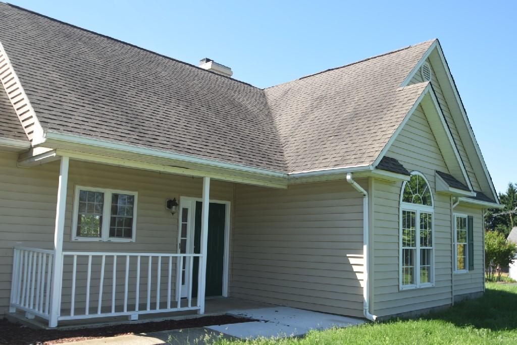 4027 Goodview Town Road Moneta, VA 24121 - Photo 2 of 21 a side view of a house with a yard