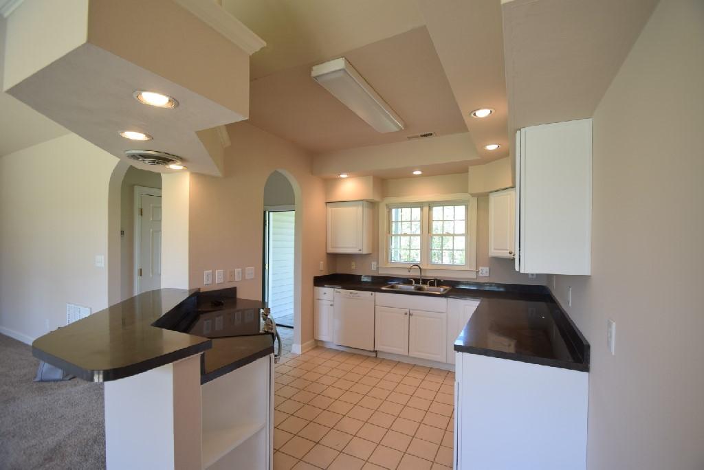 4027 Goodview Town Road Moneta, VA 24121 - Photo 3 of 21 a kitchen with granite countertop a sink and a stove