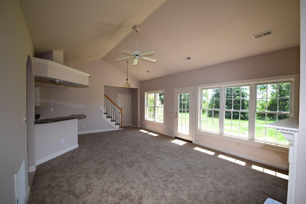 4027 Goodview Town Road Moneta, VA 24121 - Photo 7 of 21 a view of an empty room with a sliding door