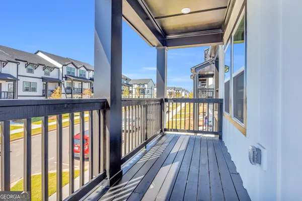 a view of balcony with wooden floor