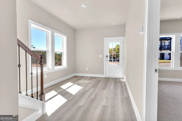 wooden floor in a room next to a window