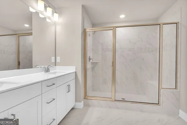 a bathroom with a double vanity sink and a mirror
