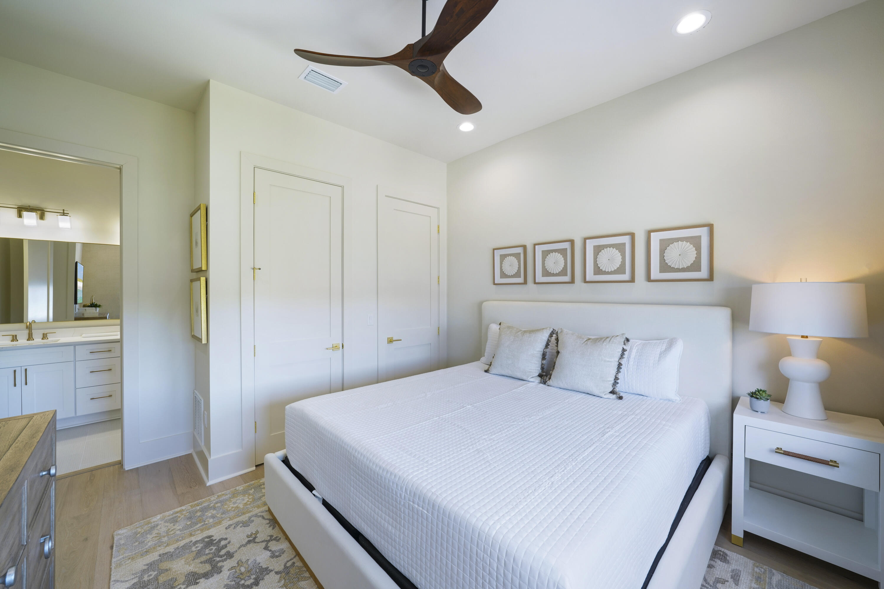 56 Sea Croft Cove Santa Rosa Beach, FL 32459 - Photo 46 of 65 a bedroom with a large bed and a chandelier