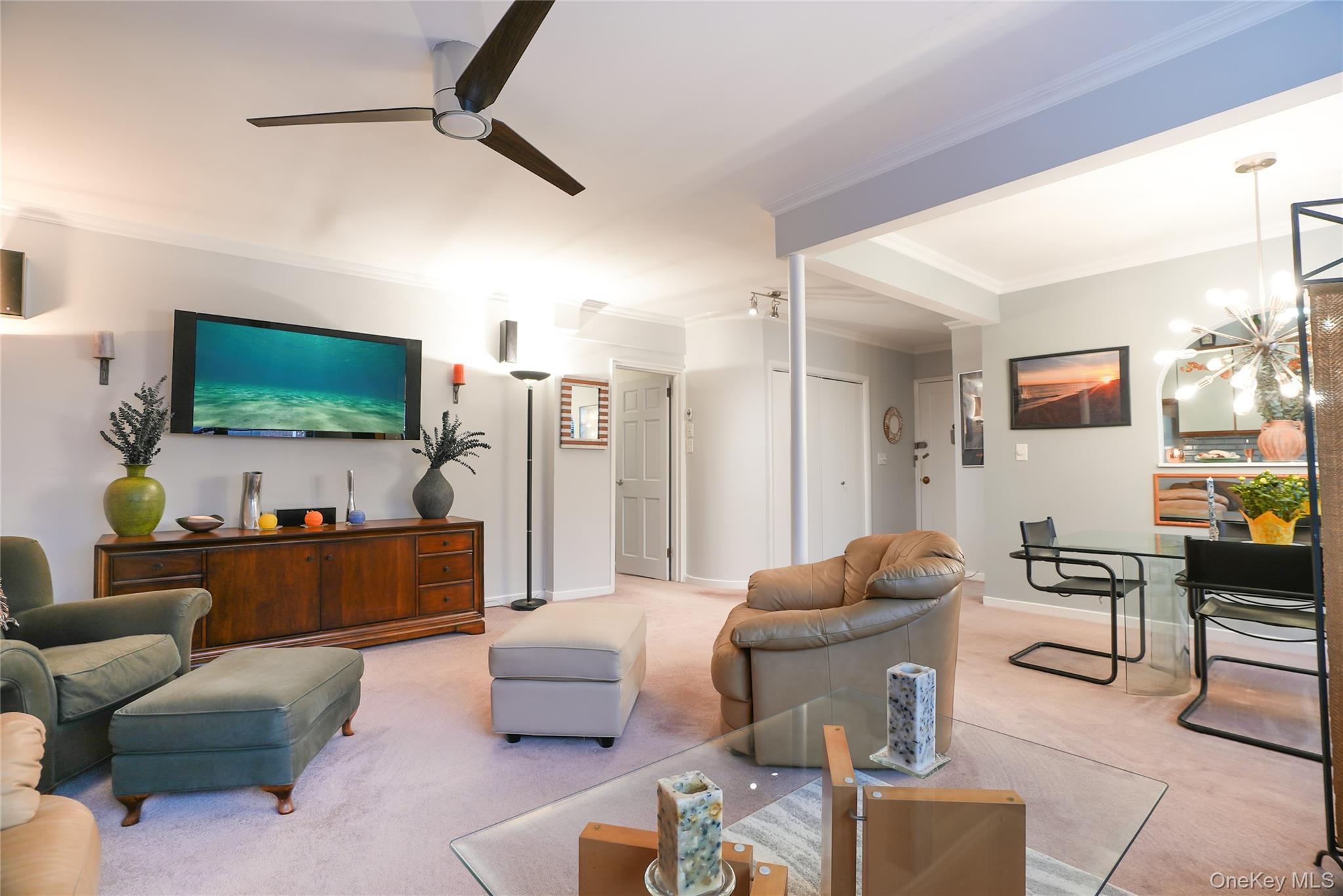 35 Rockledge Road, Unit 2A Hartsdale, NY 10530 - Photo 4 of 20 a living room with furniture and a flat screen tv