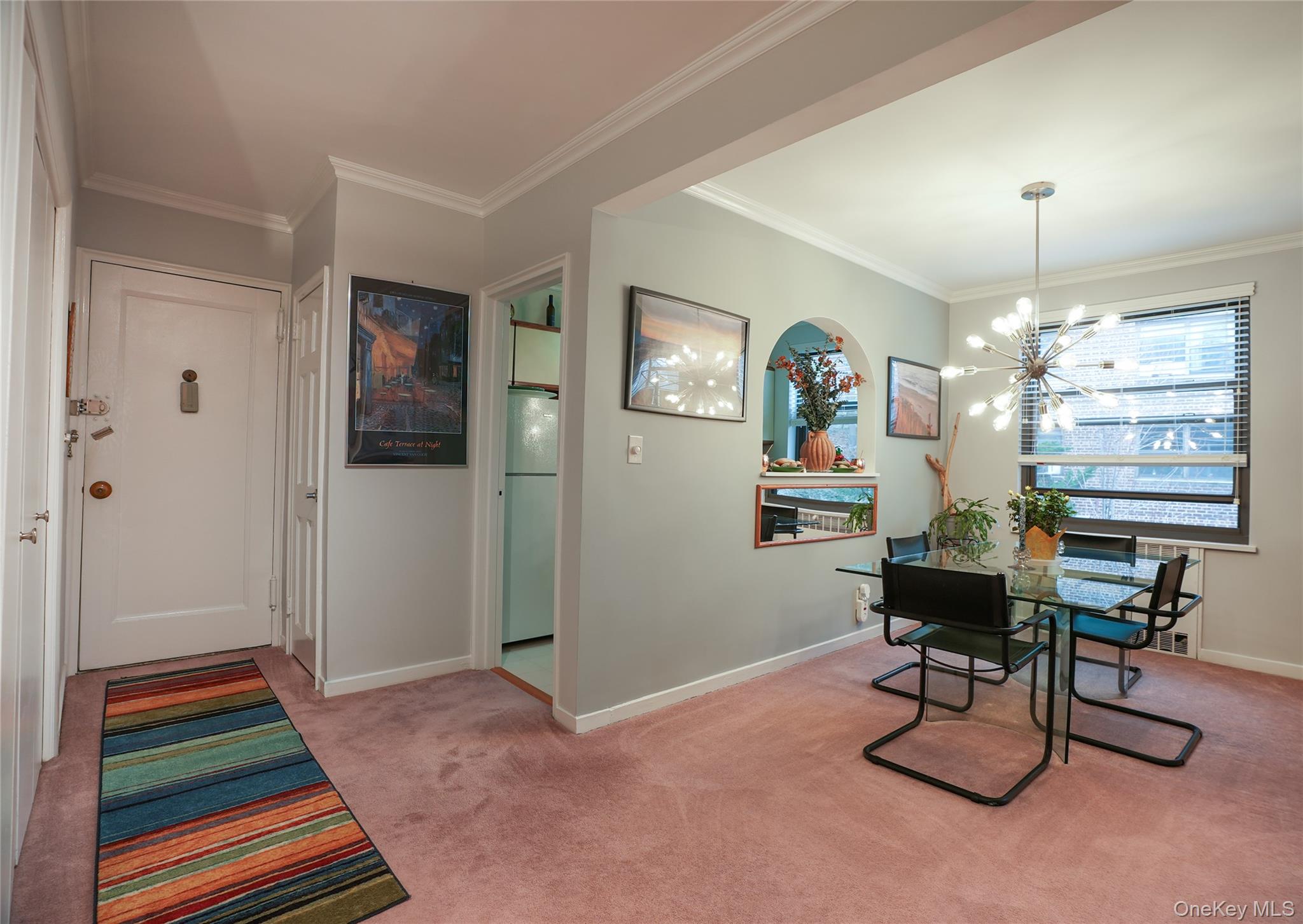 35 Rockledge Road, Unit 2A Hartsdale, NY 10530 - Photo 6 of 20 a workspace with furniture and a chandelier