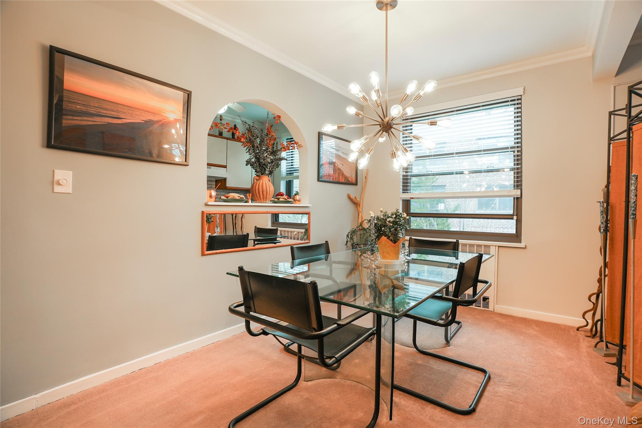 35 Rockledge Road, Unit 2A Hartsdale, NY 10530 - Photo 7 of 20 a view of a dining room with furniture and a chandelier