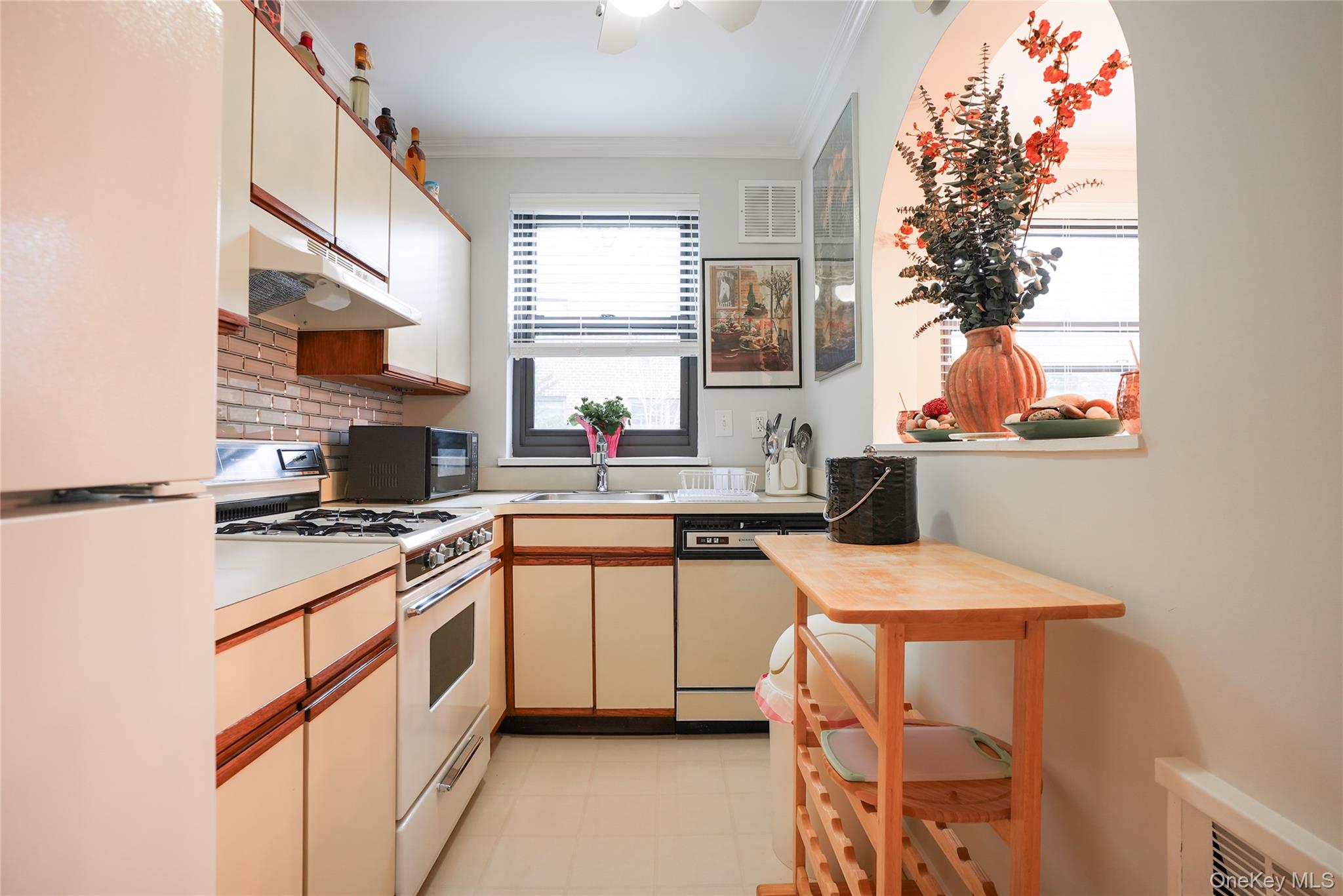 35 Rockledge Road, Unit 2A Hartsdale, NY 10530 - Photo 10 of 20 a kitchen with a sink stove and cabinets
