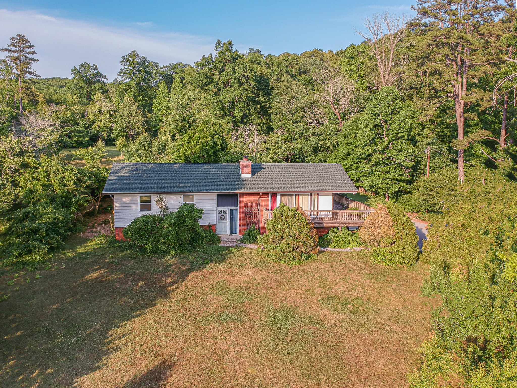 1441 Paint Rock Ferry Road Kingston, TN 37763 - Photo 1 of 13 a view of a big house with a big yard and large trees