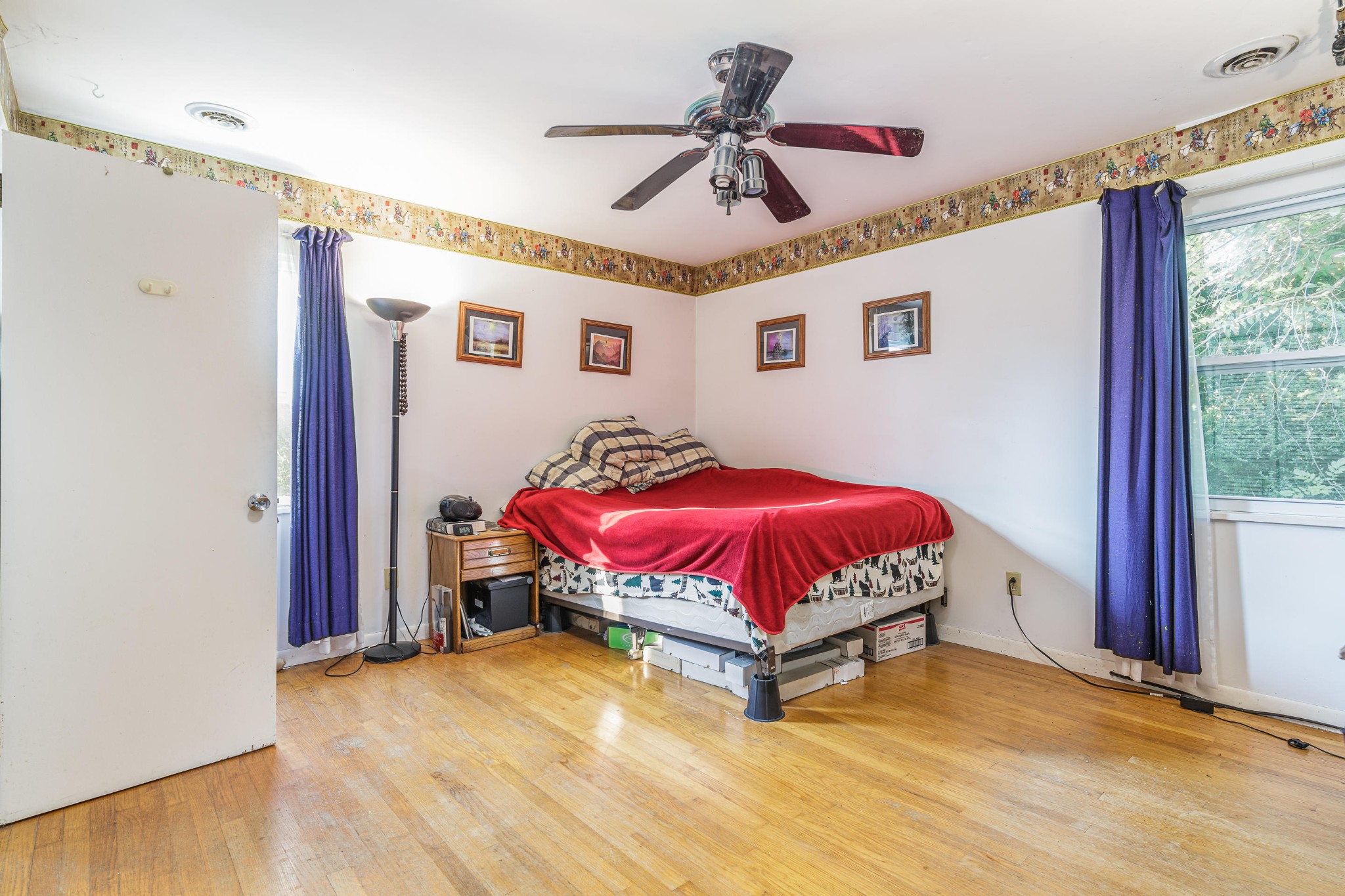 1441 Paint Rock Ferry Road Kingston, TN 37763 - Photo 7 of 13 a bedroom with a bed and a chandelier