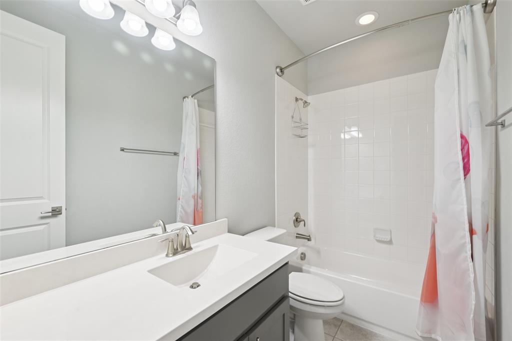 3415 Secretariat Place Celina, TX 75009 - Photo 16 of 40 a bathroom with a sink a toilet and shower